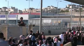 Muslim worshippers at Israeli-controlled checkpoint as they make their way to attend prayer