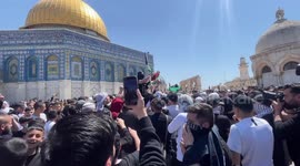 Palestinian Muslim worshippers shout slogans during a protest following Friday prayers at Jerusalem's al-Aqsa Mosque complex