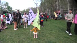 XR baby poses with flags outside The Tate Modern, London