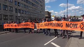 Extinction Rebellion block Waterloo Bridge before marching to Tate Modern in London