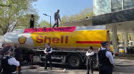 Olympic gold medallist Etienne Stott blocks a fuel tanker in central London
