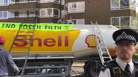 Olympic gold medallist Etienne Stott and other Extinction Rebellion activists block a fuel tanker in Bayswater,