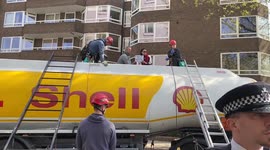 Olympic gold medallist Etienne Stott blocks a fuel tanker in London