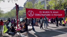 Extinction Rebellion protestors block central Paris square, France