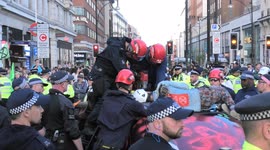 Climate protester dramatically cut free after gluing herself to car roof
