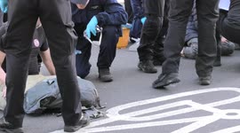 XR protesters glued to the ground removed by police at Marble Arch