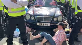 Extinction Rebellion block Marble Arch with a limousine