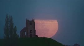 Spooky Pink Moon rises behind church ruins in Somerset