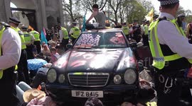 Police surround limousine at Marble Arch in London as climate activists glue themselves to the vehicle