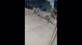 Kharkiv shell dramatically explodes just as woman crosses the street
