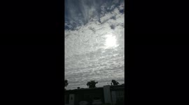 Sun Piercing through the Gloomy Clouds Forming an Eye in the Sky