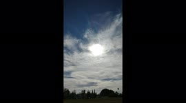 Sun Piercing through gloomy clouds forming an eye in the sky