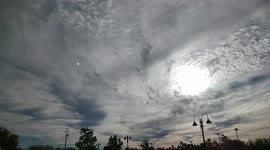 Sun Piercing through the gloomy clouds to form an eye in the sky