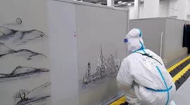 Chinese doctor draws city landmarks onto walls of makeshift hospital in Shanghai