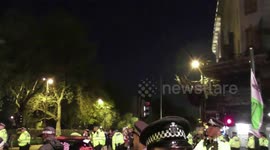 MET Police bring a JCB to tow a car away used by protesters to block marble arch