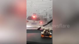 Egg-sized hail pelts drivers and cracks windshields in Qianxinan, China