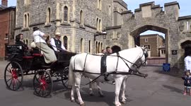 Tourists enjoy Windsor Town Horse Drawn Carriage Tour on sunny Easter weekend