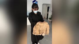 Pricy fur coat shrinks to child's size after being cleaned with water in China