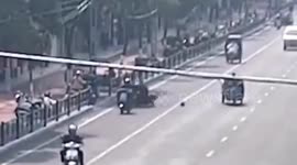 Boy causes scooter accident after kicking football into road in China