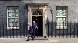 Under fire Boris Johnson leaves Downing Street ahead of PMQs