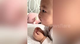 Eating livestream makes this toddler drool and reach out for food in screen