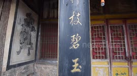 Workers examine ancient buildings and murals in northern China's Zhangjiakou city