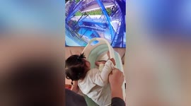 Toddler lets out scream when dad plays roller coaster game in China