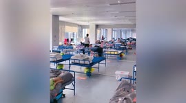 Patient in Shanghai calmly work everyday in makeshift hospital