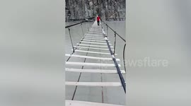 Thrill seeker crosses famous 'danger bridge' in Pakistan
