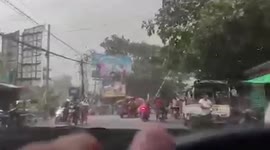 Wind blows over electricity posts into oncoming traffic in Myanmar