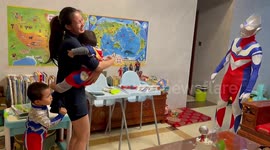 Surprise or shock? Boys in China freak out by dad dressing up as Ultraman for birthday