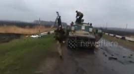 Ukrainian special forces ransack Russian vehicles on a Kharkiv bridge blown up as they were crossing it