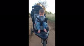 Try not to laugh: Adorable baby boy too tired to keep his eyes open while out for a walk