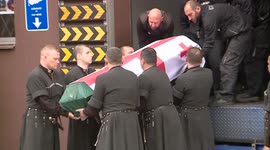 Body of Arkadi Kasradze, a Georgian fighter killed in Ukraine, arrives back in Tbilisi