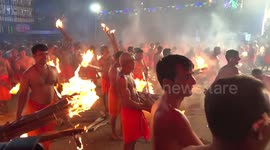 Devotees hurl balls of fire at each other to mark Agni Kheli in southern India