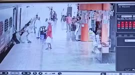 Nimble cops save man from bring dragged under a moving train in eastern India