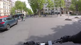 Near-miss on the streets of Paris as a woman on an electric scooter cuts dangerously across several lanes