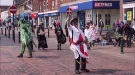 St George's Day performance with dragon, knight and Morris dancers in Kent, UK
