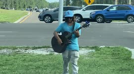 Disney worker entertaining Orlando drivers while the Florida company is in the News!!