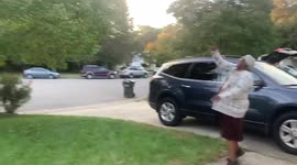 Great-grandmother and her great-grandson play catch with football