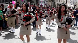 Huge crowds turn out for West Bank Christian parades ahead of Holy Fire ceremony in Jerusalem