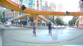 Cyclist in China doing exercise while cycling on road