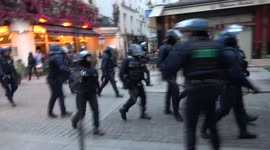 Police fire tear gas at demonstrators in French capital after Macron election victory