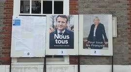 Posters of the 2022 French presidential election candidates outside polling station in London