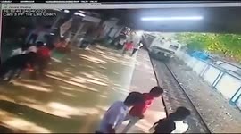 CCTV footage captures moment train derails and climbs platform