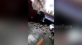 Porsche car smashes through wall and falls back into garage after just driving out in China