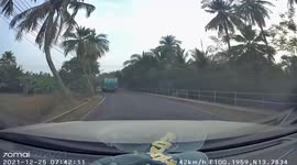 Truck nudges rider into canal while making turn on bridge