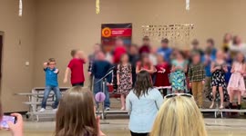 Hilarious moment US boy steals the show with freestyle dance moves at school performance