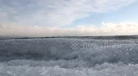 Waves of crushed ice wash ashore as temperature increases in northern China