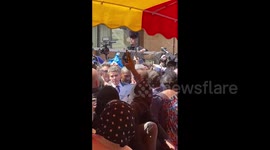 Chaos as Emmanuel Macron is surrounded and pelted with tomatoes in Paris suburb